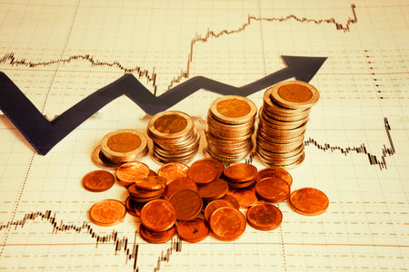 Business diagram on financial report with coinsの写真素材