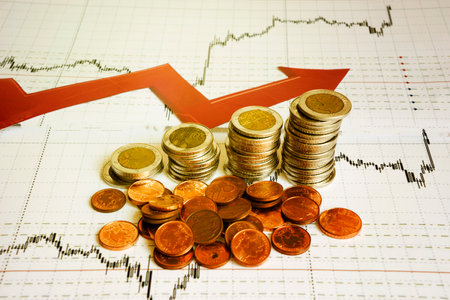 Business diagram on financial report with coinsの写真素材