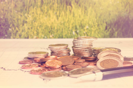 Business Finance and Money concept, Money coin stack growing graph with green bokeh background,investment conceptの写真素材