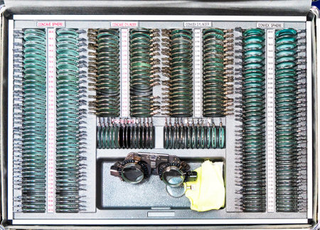 Eye examination. Selective focus. An opticians eyeglass box with many different test lenses....