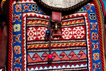 Traditional Turkish crafts. Close-up of colorful embroidered textile backpacks and bags with oriental ornamentの写真素材
