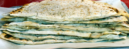Traditional azerbaijani cuisine flat bread with herbs and meat. Azerbaijan national cuisine kutab or qutabの写真素材