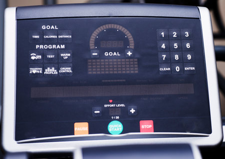 Modern gym interior with equipment. Fitness club with row of treadmills for fitness cardio training in evening backlight. Healthy lifestyle conceptの写真素材