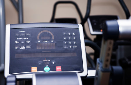 Modern gym interior with equipment. Fitness club with row of treadmills for fitness cardio training in evening backlight. Healthy lifestyle conceptの写真素材