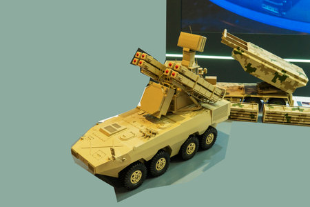 Military cars, trucks, models on a white background, at a military exhibition in Baku, Azerbaijan.