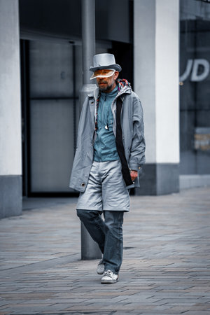 A Gentleman is walking down the street - stock photoの写真素材