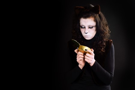 Portrait of a cat-girl with the can. Studio shot.の写真素材