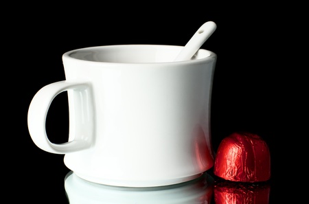 A cup of tea with sweets on a table.の写真素材