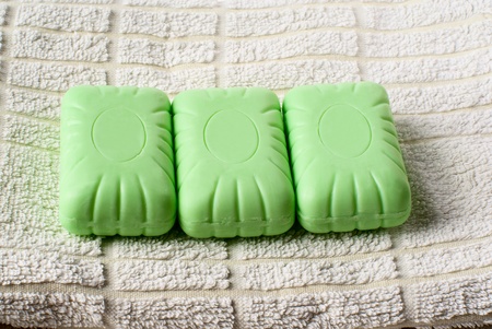 Three pieces of soap lying on towel.の写真素材