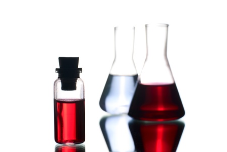 Laboratory flasks with liquid. White background. Studio shot.の写真素材