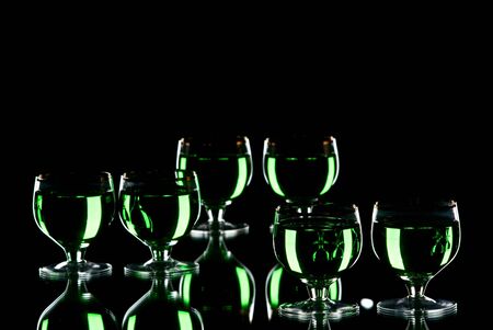 Glasses with alcohol. White background. Studio shot.の写真素材