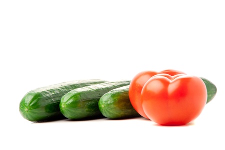 Set of tomatoes and cucumbers on white background. Studio shot.の写真素材