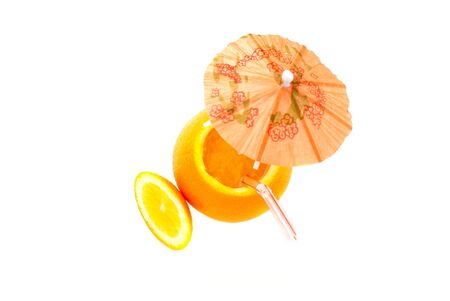 Picture of an orange-goblet with umbrella isolated on white background. studio shotの写真素材