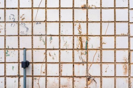 Texture of a wall covered with tiles, abstract background, natural colors, stock photo.の写真素材