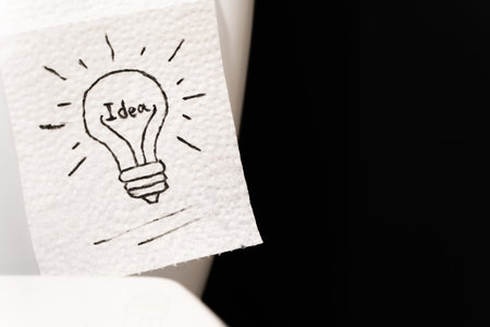 Lightbulb drawn on toilet paper, stock photo