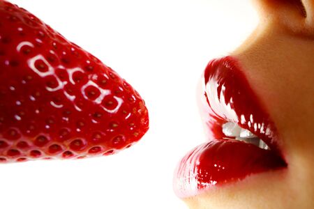 Beautiful woman red lips with strawberryの写真素材