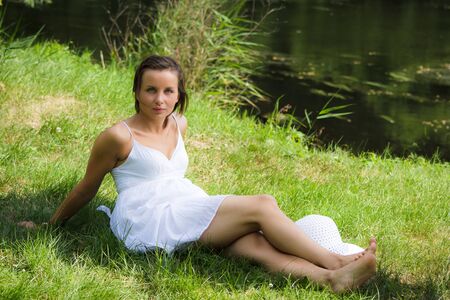 Woman in park at summerの写真素材