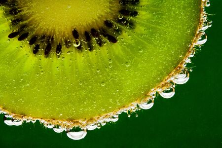 Kiwi fruit in sparkling waterの写真素材