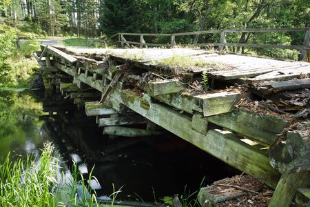 Old vintage bridge over the riverの写真素材
