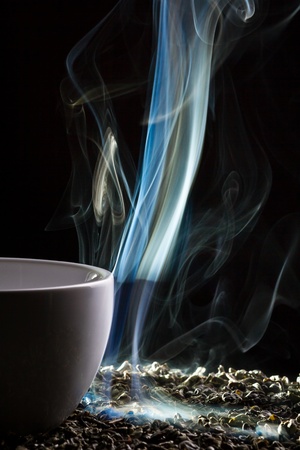 Blue smoke from cup of teaの写真素材