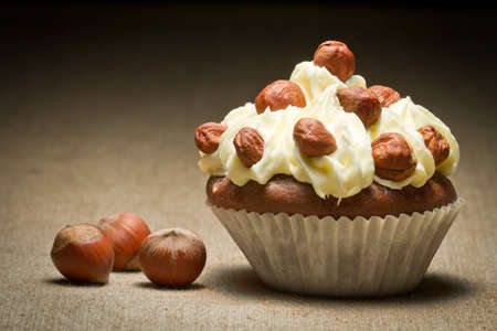 Muffin with vanilla cream and hazelnutsの写真素材