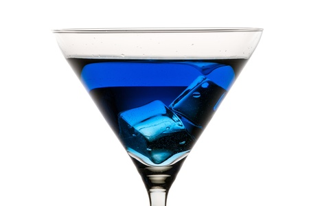 Martini glass with ice and blue liqueurの写真素材
