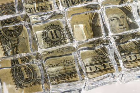 Frozen bill as a symbol of bad investmentの写真素材