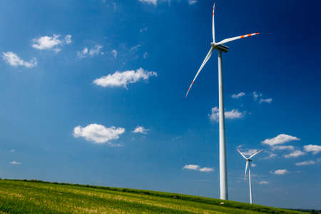 Alternative energy wind turbines on green field