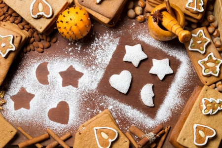 Christmas gingerbread frame surrounded by nutsの写真素材