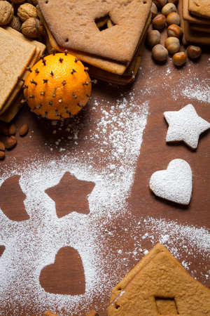Decorating gingerbread cookies with icing sugarの写真素材