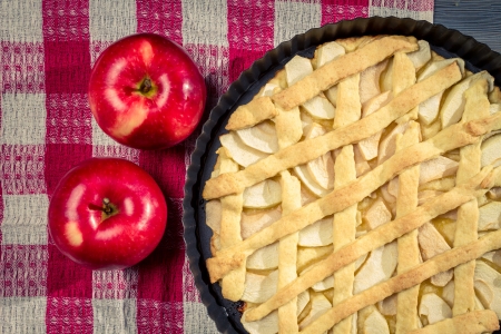 Apple pie with fruit on the tableの写真素材