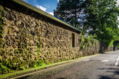Old road at the stone buildingの写真素材