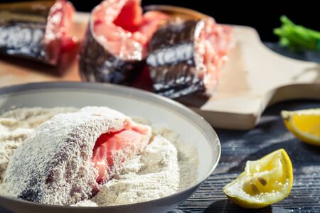 Close-up of fresh fish coated in flourの写真素材