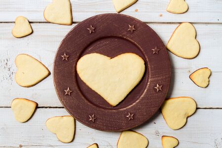 Heart-shaped cookies arranged on a plate 