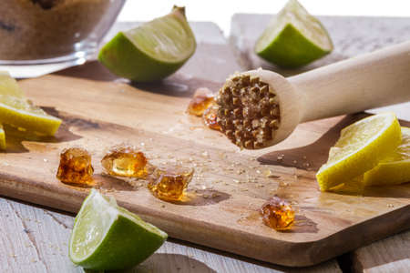 Closeup of sugar and citrus fruits as ingredients for cold ice drinkの写真素材