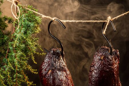 Smoked ham with juniper smokeの写真素材