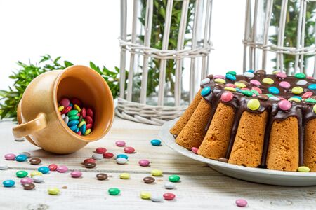 Decorating traditional easter cake with candies