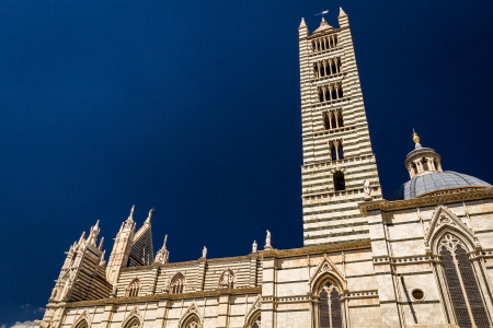Cathedral in Siena on a blue sky backgroundの写真素材