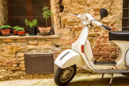 Vintage scene with Vespa on old streetの写真素材