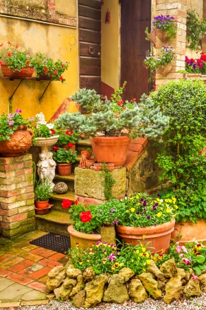 Beautiful porch decorated with flowers in the countryside, Italyの写真素材