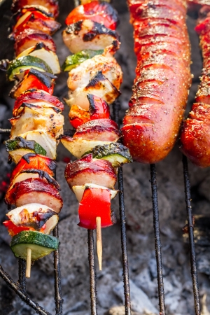 Hot skewers and sausages on the grillの写真素材