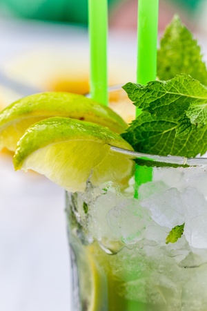 Lemon drink with lemnon, mint and ice in glassの写真素材