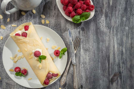 Strawberry pancakes sprinkled with icing sugarの写真素材
