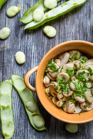 Closeup of broad beans with parsley and garlicの写真素材