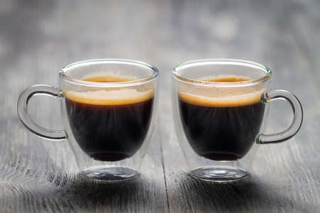 Closeup of two small cups with espressoの写真素材