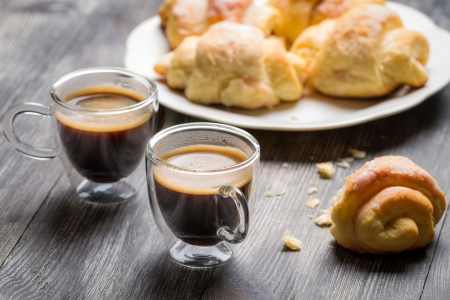 Two cups of espresso and croissants for breakfastの写真素材
