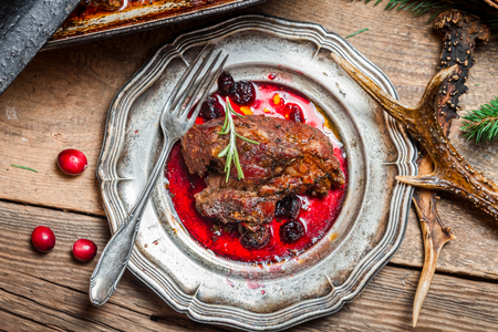 Fresh Venison with cranberry sauce and rosemaryの写真素材