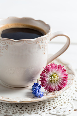 Closeup of coffee and spring flowersの写真素材