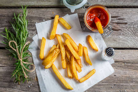 Fresh french fries served with ketchup