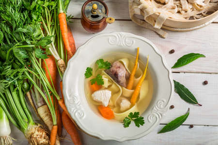 Chicken soup with noodle and vegetablesの写真素材